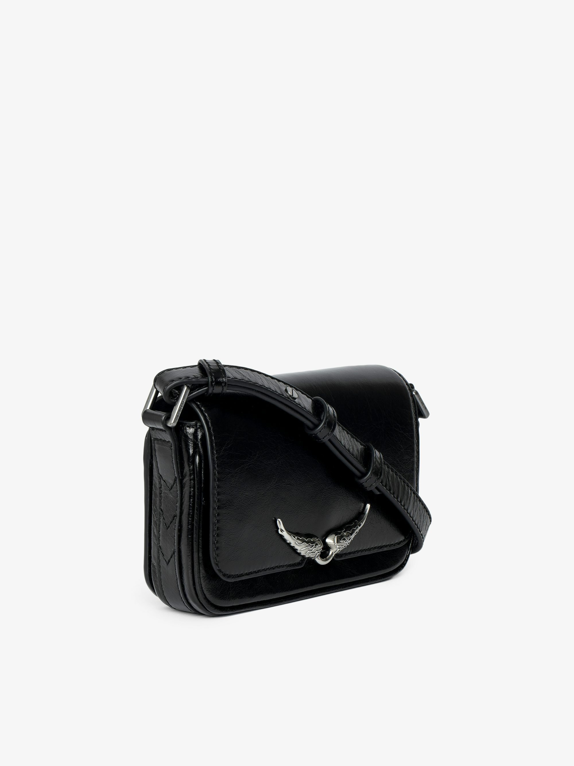 Le Zazi Vintage Patent Bag - Small vintage-inspired patent leather bag with adjustable shoulder strap and signature wings.